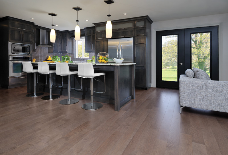 Grey kitchen featuring Greystone color hardwood floor (Maple-Greystone) For more information, visit www.miragefloors.com